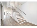 Modern staircase with wood treads and metal railing at 4015 Southpoint Lndg Way, Durham, NC 27707