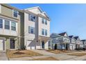 Modern townhome community with inviting streetscape and attractive landscaping at 1040 Myers Point Dr, Morrisville, NC 27560