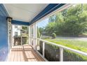 Relaxing screened porch offering outdoor space and backyard views at 105 Cooke St, Raleigh, NC 27601