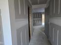 Unfinished hallway with doors to other rooms at 105 Forest Dr, Graham, NC 27253