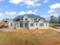 Large two-story house under construction, on a lot with dirt at 1608 Legacy Ridge Ln, Wake Forest, NC 27587