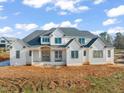 New construction home with white siding and gray roof at 1608 Legacy Ridge Ln, Wake Forest, NC 27587