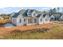 Two story home under construction, on a large lot at 1608 Legacy Ridge Ln, Wake Forest, NC 27587