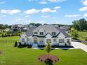 Beautiful two-story home with well-kept lawn and landscaping at 1608 Legacy Ridge Ln, Wake Forest, NC 27587