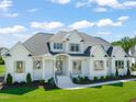 Charming two-story home with a welcoming front entrance and ample lawn at 1608 Legacy Ridge Ln, Wake Forest, NC 27587