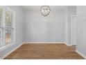 Bright dining room with hardwood floors and a chandelier at 2635 Broad Oaks Pl, Raleigh, NC 27603
