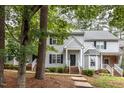 Two story house with gray siding, surrounded by trees at 2635 Broad Oaks Pl, Raleigh, NC 27603