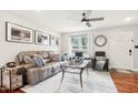 Comfortable living room with a leather sofa, area rug, and stylish furnishings at 501 Pearson Dr, Durham, NC 27713