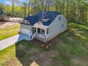 An elevated view of the house shows a well-maintained lawn and a covered porch at 5394 Salem Woods Dr # 16, Graham, NC 27253
