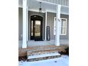 House entrance with a black door, brick steps, and a welcome sign at 55 Running Deer Path, Timberlake, NC 27583