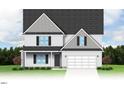 Two-story house with gray shake siding, double garage, and landscaping at 65 Tuskeegee Dr, Smithfield, NC 27577