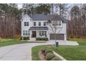 Two-story white brick home with circular driveway at 8101 Fergus Ct, Wake Forest, NC 27587