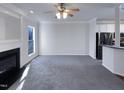 Spacious living room with grey carpet and fireplace at 1004 Cabin Hill Way, Garner, NC 27529