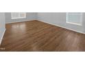 Bright bedroom with hardwood floors and large windows at 1611 Copper Cir, Mebane, NC 27302