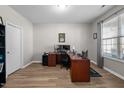 Home office with large desk, dual monitors, and built-in shelving at 241 Fair Oaks Ct, Mebane, NC 27302