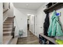 An entryway with staircase, coat rack, and shoe storage at 386 Cotton Brook Dr, Fuquay Varina, NC 27526