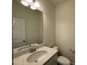 Bathroom featuring granite countertop, large mirror, white cabinets and a toilet at 500 Traditions Grande Blvd # 22, Wake Forest, NC 27587