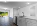 Open-concept kitchen features granite countertops and stainless steel dishwasher at 500 Traditions Grande Blvd # 22, Wake Forest, NC 27587