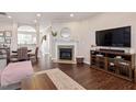 Open concept living space with fireplace and hardwood floors at 891 Cupola Dr, Raleigh, NC 27603