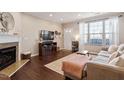 Living room features fireplace and large windows at 891 Cupola Dr, Raleigh, NC 27603