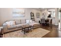 Spacious living room with hardwood floors and comfy seating at 891 Cupola Dr, Raleigh, NC 27603