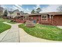 House exterior showcasing a large deck and a well-manicured lawn at 1009 Deboy St, Raleigh, NC 27606
