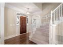 Bright and spacious entryway with hardwood floors and elegant staircase at 114 Legault Dr, Cary, NC 27513