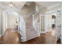 Two-story entryway with hardwood floors and a grand staircase at 114 Legault Dr, Cary, NC 27513