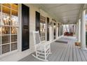Relaxing front porch with rocking chair and swing at 114 Legault Dr, Cary, NC 27513