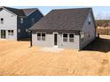 View of the home's backyard with freshly installed grass, showcasing a neat and tidy space at 213 Little Crk Dr, Lillington, NC 27546