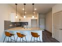 Modern kitchen with granite countertops, stainless steel appliances, and white shaker cabinets at 2206 Gathering Sq Ct # 2206, Fuquay Varina, NC 27526