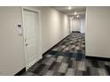Modern apartment hallway with neutral walls and patterned carpet at 2313 Gathering Square Ct # 2313, Fuquay Varina, NC 27526