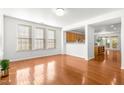 Bright dining room with hardwood floors and kitchen views at 3141 Rapid Falls Rd, Cary, NC 27519