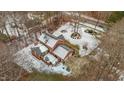 Aerial view of house, yard, and driveway with snow on the ground at 4139 Somerset Dr, Oxford, NC 27565