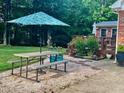 Backyard featuring a picnic table and wood deck, perfect for outdoor entertaining at 4139 Somerset Dr, Oxford, NC 27565