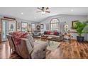 Spacious living room with hardwood floors, comfy furniture, and a ceiling fan at 4139 Somerset Dr, Oxford, NC 27565