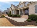 House exterior with walkway, landscaping, and brickwork at 416 Calderbank Way, Cary, NC 27513