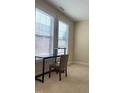 Bright bedroom with two large windows and a desk at 549 Balsam Fir Dr Dr, Cary, NC 27519