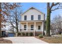 Two-story craftsman home with white siding, black windows, and a front porch at 649 Mcadams Rd, Hillsborough, NC 27278