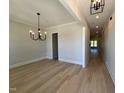 Open floor plan combining the Dining Room and Hallway with hardwood floors at 1031 Coldspring Circle, Durham, NC 27705