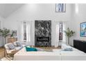 Spacious living room features a large marble fireplace and hardwood floors at 113 Laurston Ct, Durham, NC 27712