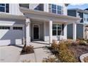 Inviting front porch with white columns, landscaping, and the house number prominently displayed at 137 Alderbranch Cir, Garner, NC 27529