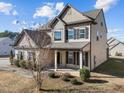 Two-story house with neutral siding and landscaping, side view at 1425 Stone Wealth Dr, Knightdale, NC 27545