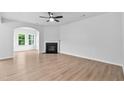 Spacious living room with hardwood floors, fireplace, and large windows for lots of natural light at 2094 Harris Farm Ct, Burlington, NC 27215