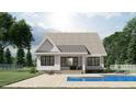 Rear view of house showcasing the pool and patio at 2423 Bivins Rd, Durham, NC 27712