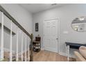 Entryway with staircase, shoe storage, and a small table at 263 Langdon Chase Way, Selma, NC 27576