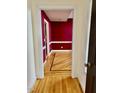 Elegant dining room with hardwood floors and burgundy walls at 59 Mar-Joy Dr, Dunn, NC 28334