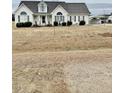 House exterior showcasing landscaping and a carport at 59 Mar-Joy Dr, Dunn, NC 28334