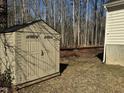 Tan colored storage shed in backyard at 6020 Newhall Rd, Durham, NC 27713