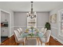 Bright dining room with a glass table and chandelier at 1117 Beechwood Dr, Rocky Mount, NC 27803